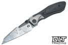 Null Voodoo Doll - Glass Bead Blast Titanium Bolster - Black Camo Carbon Fiber - Bjorkman's Twist Acidwash Damasteel Blade
