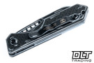 Heretic Jinn Auto - Wharncliffe MagnaCut Blade - Black & White Cel Shading - Glow Carbon Fiber Chassis