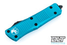Microtech 138-1TQ Troodon D/E - Turquoise Handle - Black Blade