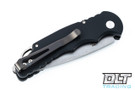 Pro-Tech TR-5 Tactical Response knife with black handles shown closed on the pocket clip side. 