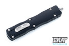 Microtech 225-12 Dirac D/E - Black Handle - Full Serrations - Stonewashed Blade Microtech 225-12 Dirac D/E - Black Handle - Full Serrations - Stonewashed Blade