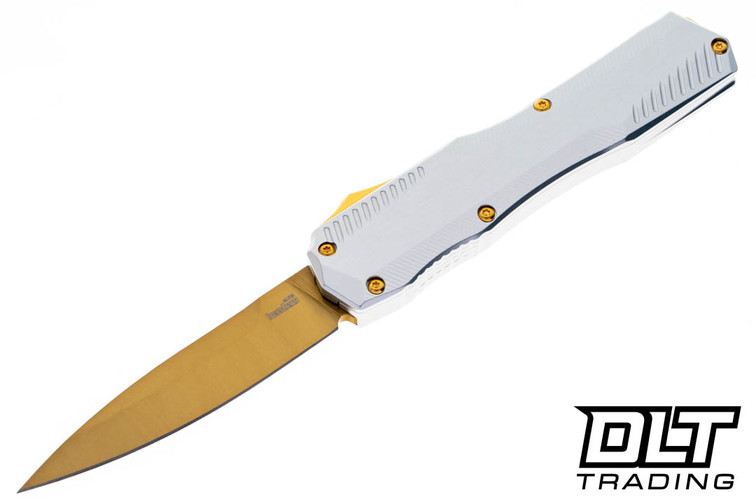 Kershaw Livewire Aurum with a gold spear point blade and a raw aluminum handle shown in the open position. 