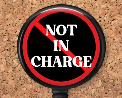 Not in Charge Badge Reel