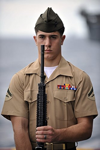 Posterazzi U-S- Marine presents arms during a ceremony commemorating the 70th anniversary of the attack on Pearl Harbor Poster Print  -11 x 17-