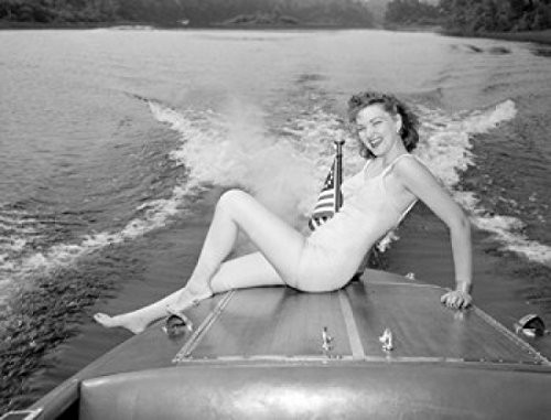 Posterazzi Young woman in bikini sitting on speed boat Poster Print -18 x 24- Posterazzi Young woman in bikini sitting on speed boat Poster Print -18 x 24-