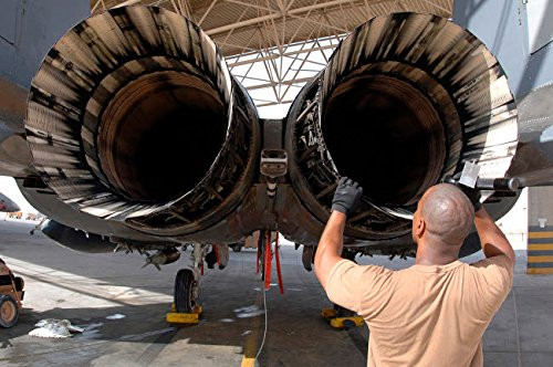 Posterazzi Poster Print Collection a Maintainer Inspects the Engine of an F-15E Strike Eagle Stocktrek Images  -17 x 11-  Multicolored