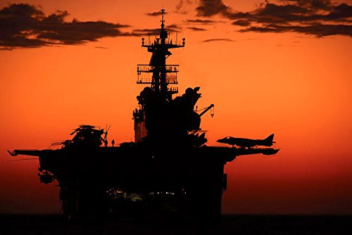 Posterazzi Poster Print Collection the Setting Sun Silhouettes the Amphibious Assault Ship Uss Makin Island Stocktrek Images  -17 x 11-  Multicolored