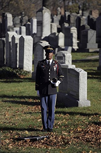 Posterazzi An Army soldier stands in the Cypress Hills National Cemetery waiting to play taps Poster Print 11 x 17