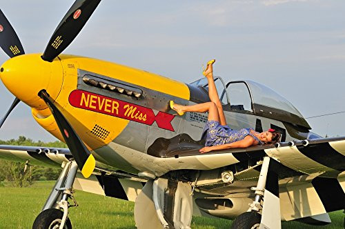 Posterazzi 1940s style pin-up girl lying on the wing of a P-51 Mustang fighter plane Poster Print 17 x 11 Posterazzi 1940s style pin-up girl lying on the wing of a P-51 Mustang fighter plane Poster Print 17 x 11