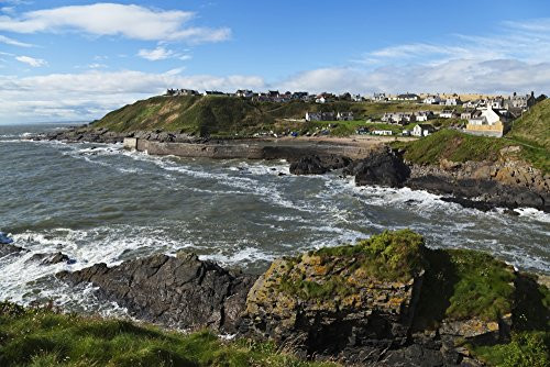 Posterazzi Waves crashing along the coast with buildings in the town Grampian Scotland Poster Print 19 x 12