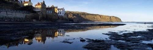 Posterazzi Reflection Of Buildings In Water Robin Hoods Bay North Yorkshire England United Kingdom Poster Print 36 x 12