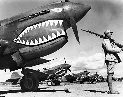 World War Ii China 1943 Na Chinese Soldier Guards A Squadron Of Curtiss P-40 Warhawk Fighter Planes In China During World War Ii 1943 Poster Print by 18 x 24