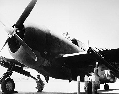 World War Ii Thunderbolt Na Soldier Of The US Army Air Force Loading A Rocket Into One Of The Underwing Tubes On A P-47 Thunderbolt Fighter Plane During World War Ii Photographed In 1944 Poster Print