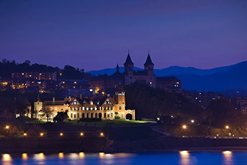 Buildings lit up at Miramar Park at dusk San Sebastian Guipuzcoa Province Basque Country Region Spain Poster Print by Panoramic Images 24 x 18