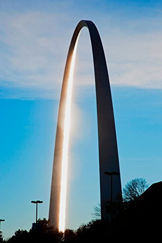 The sunset reflects on the majestic Gateway Arch the Jefferson National Expansion Memorial the Gateway to the West is 630 fight higy and is in St Louis Mo Along the Mississippi River Poster Print by P