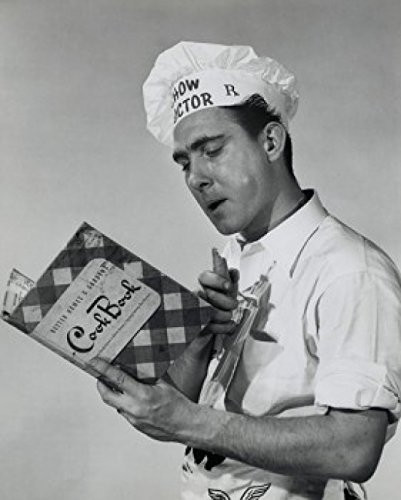 Posterazzi Close-up of a mid adult man reading a cookbook Poster Print 18 x 24