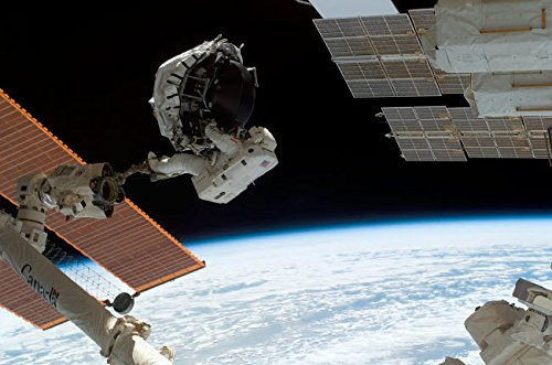 Posterazzi Poster Print Collection an Astronaut Anchored to the Foot Restraint on the Canadarm2 Stocktrek Images 17 x 11 Multicolored