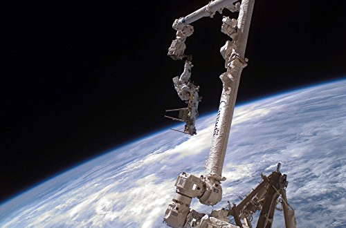 Posterazzi An astronaut anchored to the International Space Stations Canadarm2 foot restraint Poster Print 16 x 11