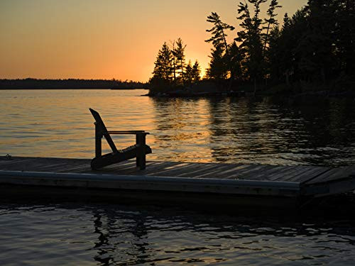 Posterazzi DPI12511939 A Wooden Adirondack Chair Sits on a Dock on a Tranquil Sunset Lake of The Woods Ontario Canada Photo Print 17 x 13 Multi