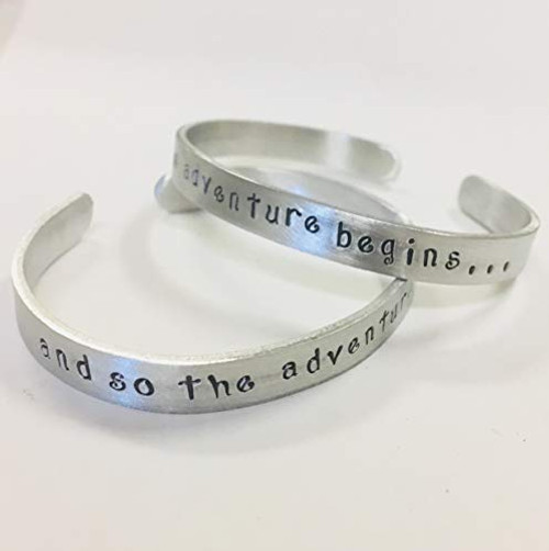inchand so the adventure begins. inch Bracelet hand stamped on a non tarnish aluminum cuff bracelet inchand so the adventure begins. inch Bracelet hand stamped on a non tarnish aluminum cuff bracelet