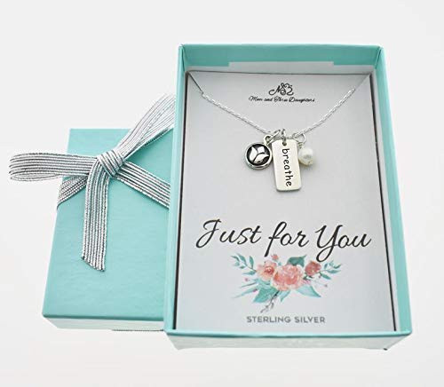 Lotus Charm Pendant in Sterling Silver on an 18 inch sterling silver cable chain Accented by a Breathe Word Charm and Swarovski Pearl. Lotus Charm. Lotus Necklace. Breathe Charm Lotus Charm Pendant in Sterling Silver on an 18 inch sterling silver cable chain Accented by a Breathe Word Charm and Swarovski Pearl. Lotus Charm. Lotus Necklace. Breathe Charm