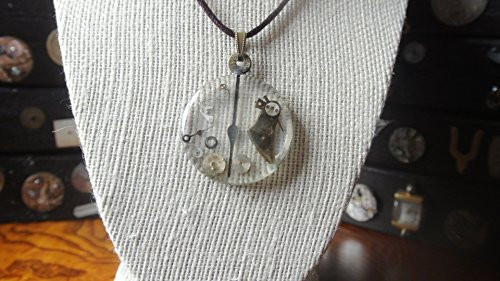 Adjusting the time-Round watch crystal with watch parts on a brown leather chain