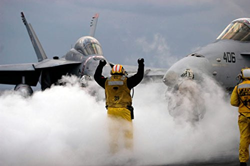 Posterazzi Poster Print Collection an Airman Directs an F/a-18C Hornet Onto a Catapult Aboard Uss Kitty Hawk Stocktrek Images, (17 x 11), Multicolored