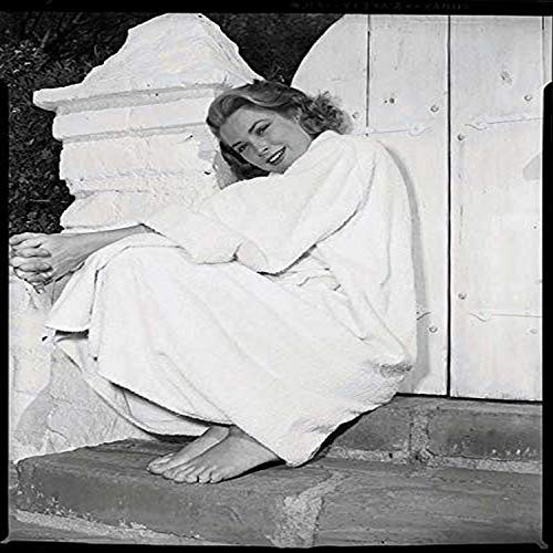Posterazzi DAP18328 Grace Kelly - Sitting in Robe Against Fence Photo Print  8 x 10  Multi