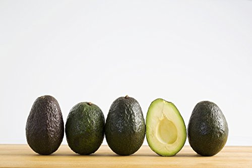 Posterazzi A Row Of Avocados Standing Upright On A Wooden Board With One Cut In Half Without The Pit Calgary Alberta Canada Poster Print   19 x 12