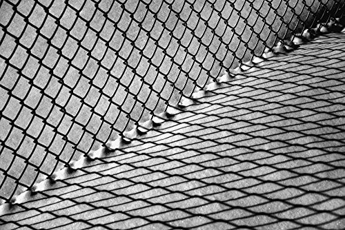 Posterazzi Chain link fence and shadow on snow Waterloo Quebec Canada Poster Print   19 x 12