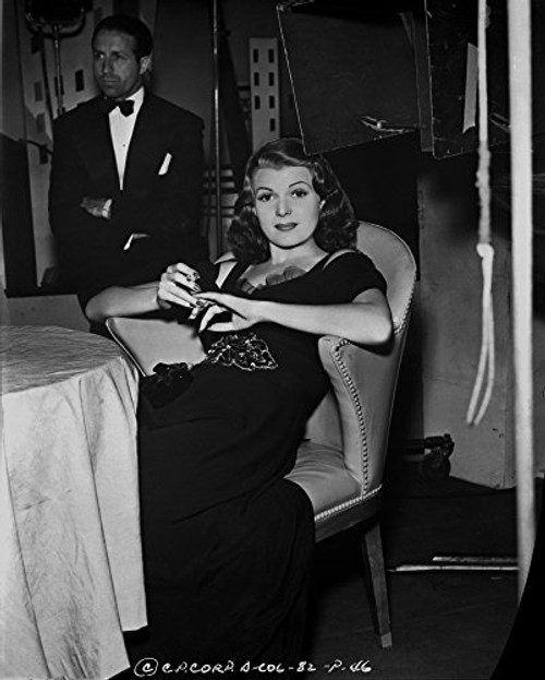 Posterazzi Rita Hayworth Lounging on Chair in Black Gown Photo Print (8 x 10) Posterazzi Rita Hayworth Lounging on Chair in Black Gown Photo Print (8 x 10)