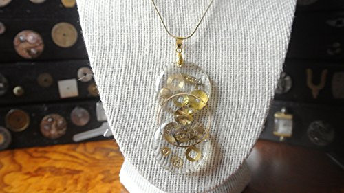Twin Times-Two round watch crystals with watch parts on a gold snake chain