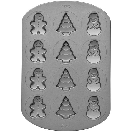 Wilton Non-Stick Christmas Cookie Shapes Pan, 12-Cavity (Gingerbread Man, Tree, Snowman) Wilton Non-Stick Christmas Cookie Shapes Pan, 12-Cavity (Gingerbread Man, Tree, Snowman)