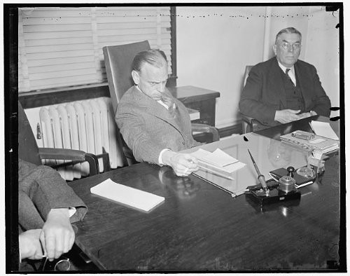 HistoricalFindings Photo: James M Landis,Chairman,Securities,Exhange Commission,Table,Washington DC,1937