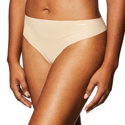 Calvin Klein Women's Invisibles Seamless Thong Panty, Light Caramel, Large