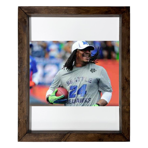 Marshawn Lynch - 14X17 Full Color Photo Sign With Wood Frame PTR #G327158 Marshawn Lynch - 14X17 Full Color Photo Sign With Wood Frame PTR #G327158