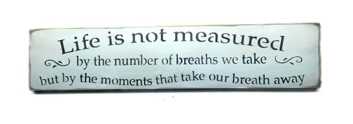 Wooden Sign/Life is Not Measured by The Breaths We Take but by The Moments That Take Our Breath Away