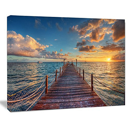 Designart PT14640-20-12 Brilliant Sunrise Over Sea PierModern Bridge Canvas Wall Art 12" H x 20" W x 1" D 1P