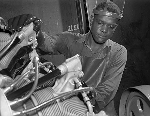 Production Aircraft engines A young Negro worker stands ready to wash or degrease this airplane motor prior to its shipment Hes an employee of a large Midwest airplane plant Melrose Park Buick plant P