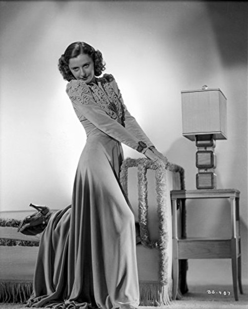 Barbara Stanwyck standing Side View with Legs Raised Photo Print (8 x 10)