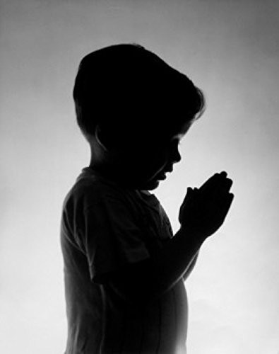 Posterazzi Side profile of a boy praying Poster Print (18 x 24)