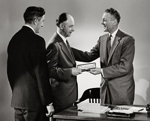 Side profile of a businessman presenting a gift to another businessman Poster Print (18 x 24)