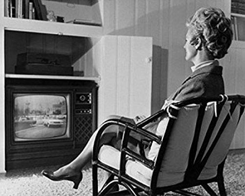 Side profile of a mature woman watching television Poster Print (18 x 24) Side profile of a mature woman watching television Poster Print (18 x 24)
