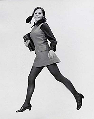 Side profile of a teenage girl carrying books and smiling Poster Print (18 x 24)