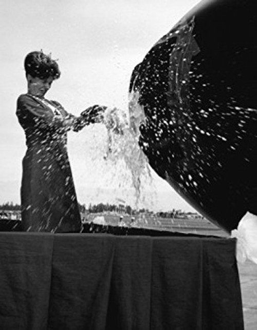 Posterazzi Side Profile of a Young Woman Breaking a Champagne Bottle at an Airplane Inauguration 1966 Poster Print, (18 x 24) Posterazzi Side Profile of a Young Woman Breaking a Champagne Bottle at an Airplane Inauguration 1966 Poster Print, (18 x 24)