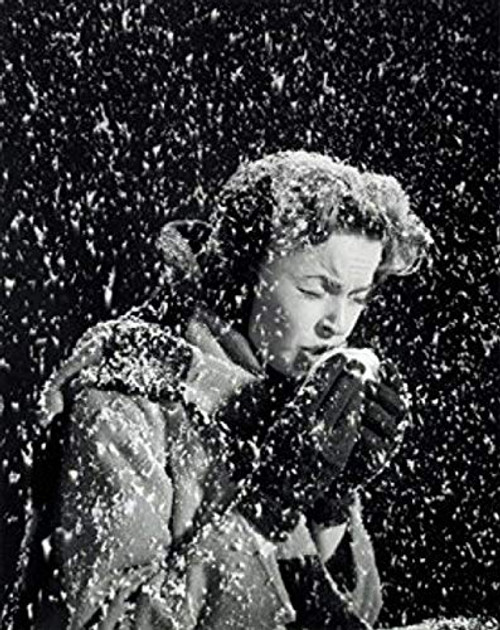 Side profile of a young woman sneezing in a snow fall Poster Print (18 x 24) Side profile of a young woman sneezing in a snow fall Poster Print (18 x 24)