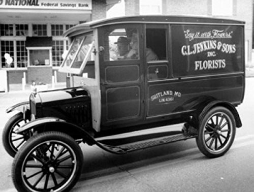 Side profile of two men sitting in a truck Poster Print (18 x 24)