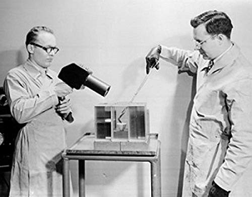 Posterazzi Side profile of two scientists experimenting in a laboratory PPG Industries Poster Print (18 x 24)
