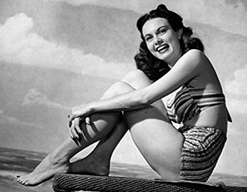 Posterazzi Side profile of young woman sitting on beach Poster Print (18 x 24) Posterazzi Side profile of young woman sitting on beach Poster Print (18 x 24)