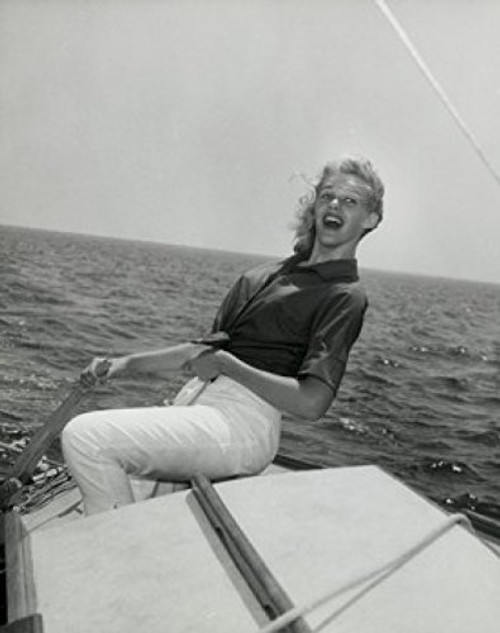 Posterazzi Side profile of young woman sitting on edge of boat and smiling Poster Print (18 x 24) Posterazzi Side profile of young woman sitting on edge of boat and smiling Poster Print (18 x 24)